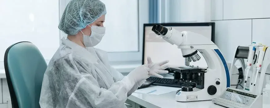 Medical researchers in laboratory reviewing breakthrough clinical health findings