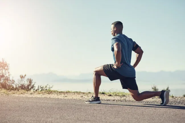Person doing dynamic stretching and mobility exercise